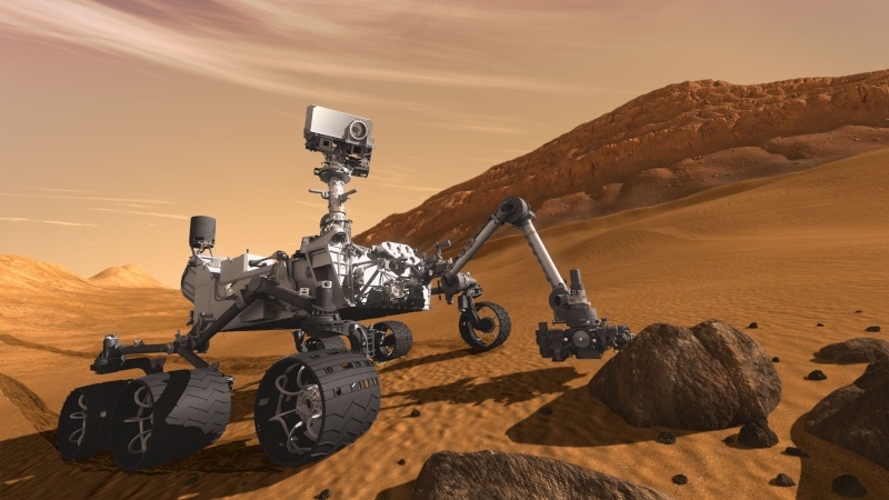 Impression of the MSL Curiosity rover at work on the planet surface. Credits: NASA/JPL-Caltech.